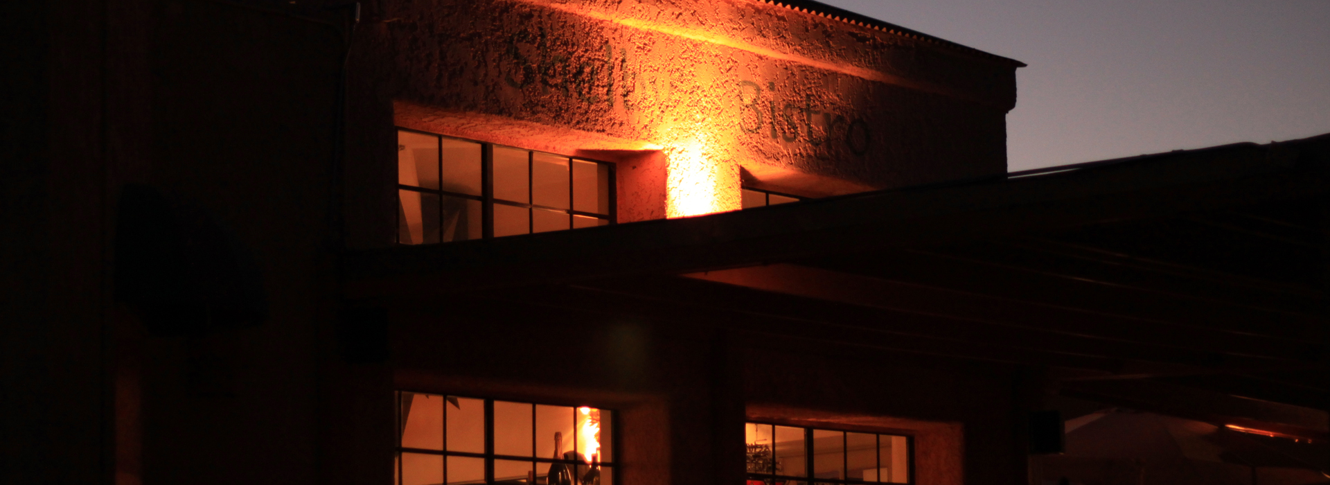 Restaurant exterior in Tubac, Arizona, illuminated at dusk